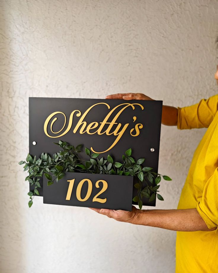 Black & Gold Horizontal Nameplate with Integrated Greenery - Modern Design