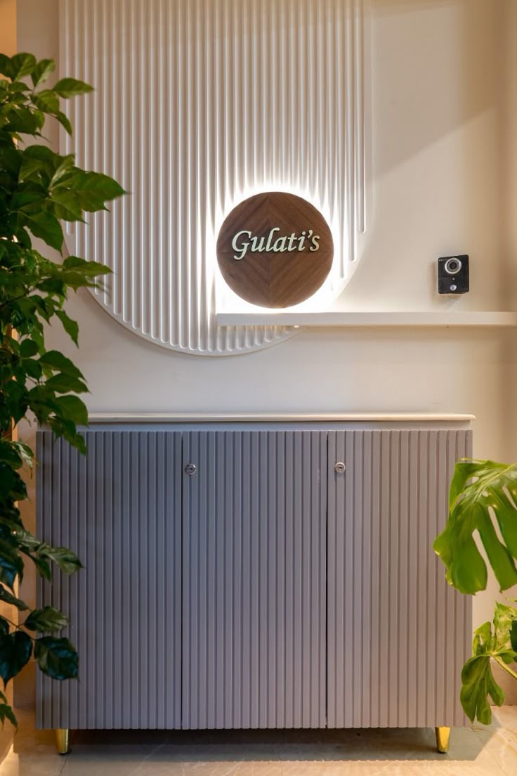 Modern Wooden Circular Nameplate on Fluted Backlit Panel